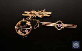 Two amethyst and seed pearl brooches and a ruby and seed pearl brooch (3) CONDITION