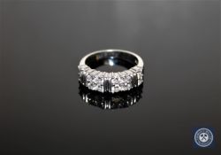 A platinum and diamond set half-eternity ring, size M/N CONDITION REPORT: 9.