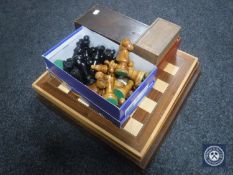 Three chess boards and four boxed sets of wooden chess pieces