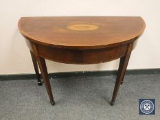 A George III mahogany and satinwood inlaid demi-lune card table with baize interior, width 97 cm.