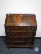 An inlaid mahogany Regency style bureau