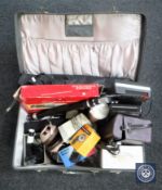 A vintage case of cassette deck, Olympus camera box, vintage speaker, Patterson 35mm proof printer,