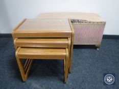 A nest of three teak glass-topped tables together with a pink loom blanket box