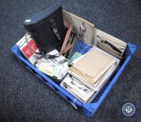 A basket of cased binoculars, cigarette cards,