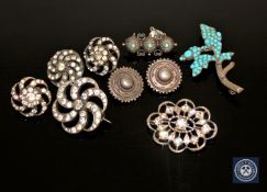 A group of silver paste brooches,