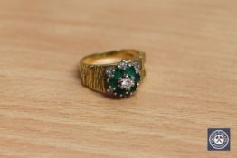 An 18ct gold emerald and diamond cluster ring, size L.