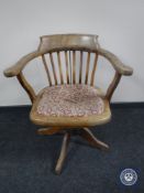 An early 20th century swivel captain's armchair