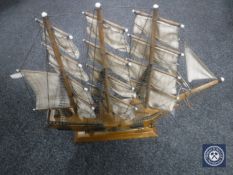 A wooden model of HMS Bounty on stand