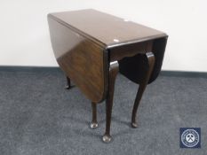 A Queen Anne style drop leaf table