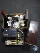 Two boxes of assorted china, cased cutlery, camera, mantel clock, die cast vehicles,