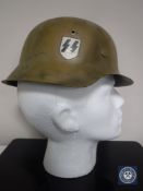 A German M42 type helmet with later SS decal