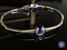 An 18ct white and yellow gold diamond and sapphire set bracelet,