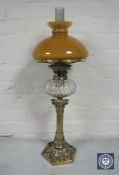 A good Victorian brass King & Brown oil lamp with glass chimney and tan shade,