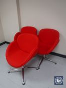 Three red upholstered reception chairs on chrome bases