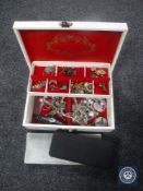 A large box of costume jewellery, necklaces, brooches etc.