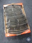 A box containing thirty pieces of Hornby 0 gauge railway track