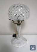 A cut glass table lamp with associated shade