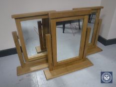 Three contemporary oak framed dressing table mirrors CONDITION REPORT: One mirror