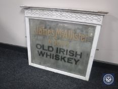 A 20th century framed mirror bearing "James McAllister & Sons Old Irish Whiskey"