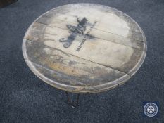 An oak barrel-topped coffee table with Old Smuggler Scotch Whisky advertising