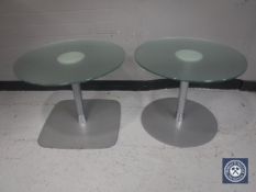 Two circular glass topped coffee tables