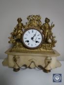 A continental alabaster and gilt metal mantel clock with enamelled dial