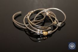 Three sterling silver and two white metal bangles (5)