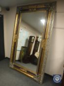 A good quality bevelled three-tone floor-standing mirror,