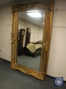 A good quality ornate bevelled gilt floor-standing mirror,