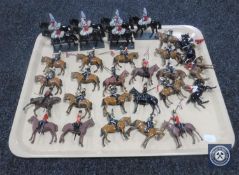 A tray containing thirty 20th century hand-painted lead figures on horseback,