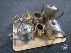 A tray containing a four-piece Sheffield EPNS tea service together with a three-piece plated tea