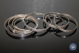 Eight sterling silver expansion bangles (8)