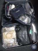 Two graduated PCL luggage cases containing lady's hand bags