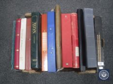 A box of thirteen assorted folders and stamp albums - stamps of the world