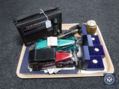 A tray containing a Binatone Europa radio, two die cast classic cars, Esso football coin collection,