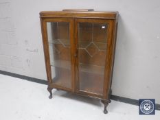 A 20th century oak display cabinet