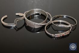 Five sterling silver bangles.