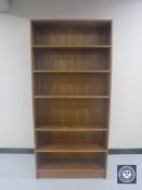 A set of teak open bookshelves