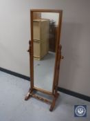 A pine cheval mirror and pair of bedside chests