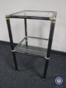 A metal and glass occasional table