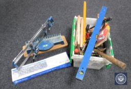 A box containing assorted hand tools, spirit level,