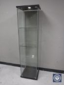 An Ikea glass display cabinet