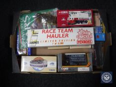 A box containing boxed die cast vehicles,
