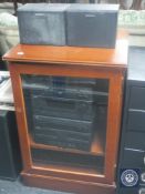 A mahogany hi/fi cabinet containing JVC hi/fi and a speaker of Sony speakers
