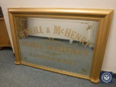 A gilt framed overmantel advertising mirror - O'Neill and McHenry, width 132 cm.