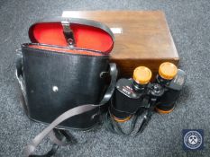 A set of cased Everest Delux binoculars and a rosewood writing box