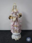 A large continental china figure of a lady with mandolin,