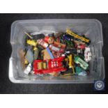 A crate containing a quantity of mid 20th century and later play-worn die cast vehicles including