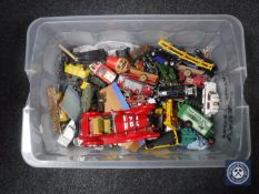A crate containing a quantity of mid 20th century and later play-worn die cast vehicles including