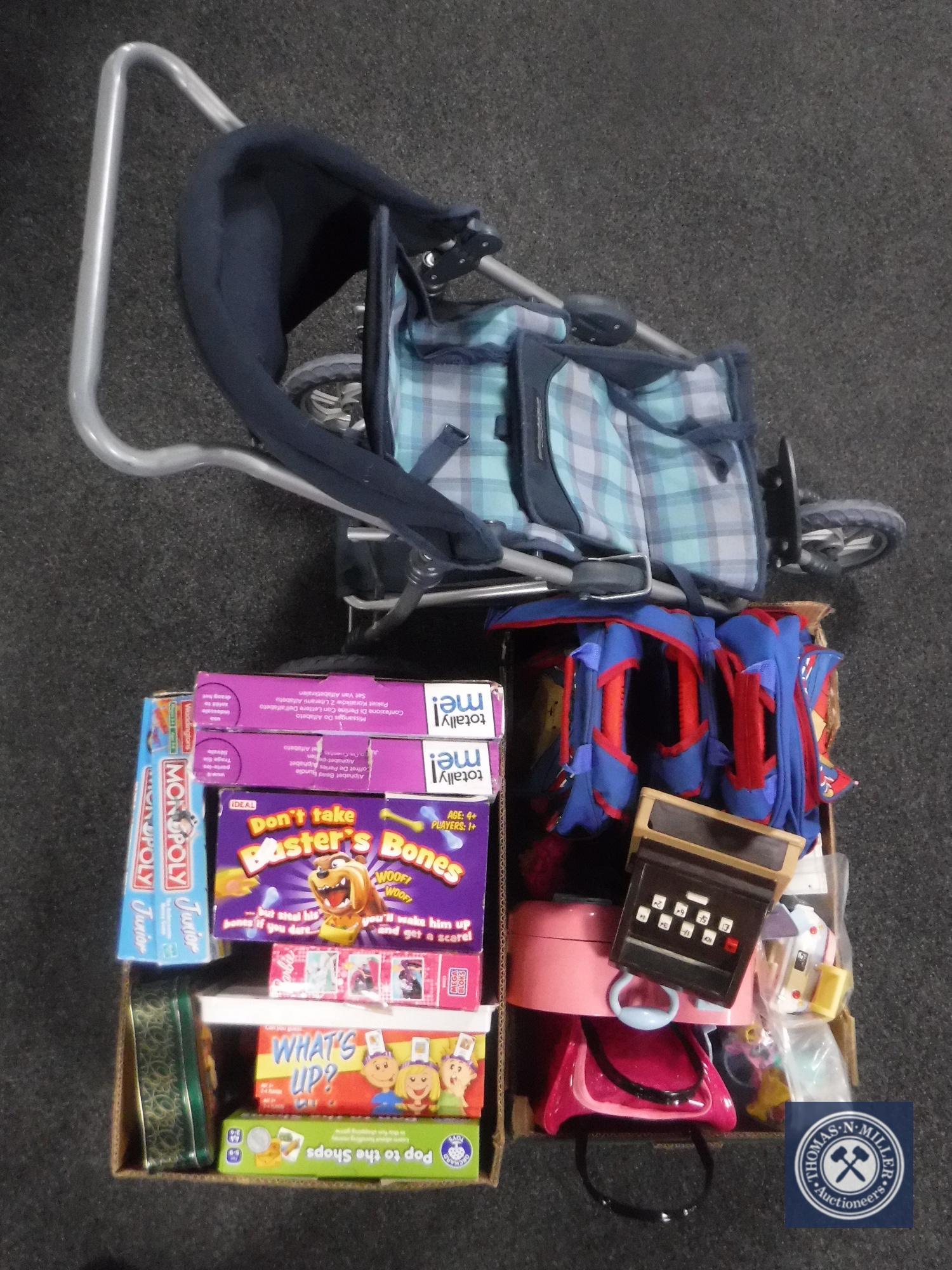 Two boxes containing children's toys, board games,